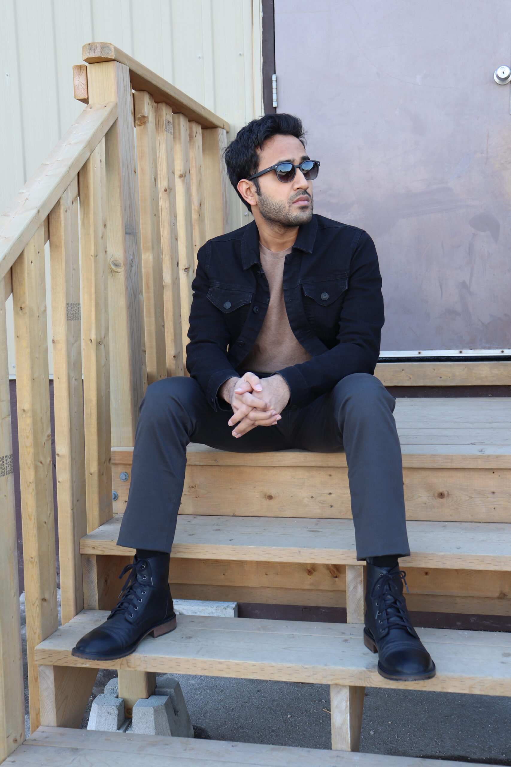 black denim jacket with chinos and brown shirt , black boots , denim jacket style