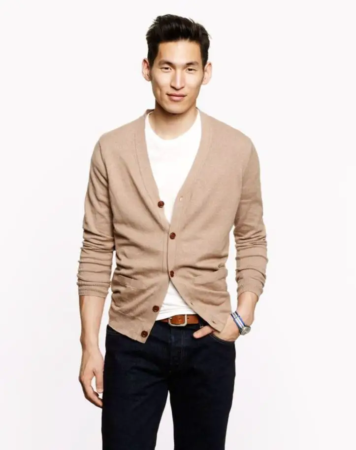 brown cardigan with dark blue jeans brown belt and off white shirt 